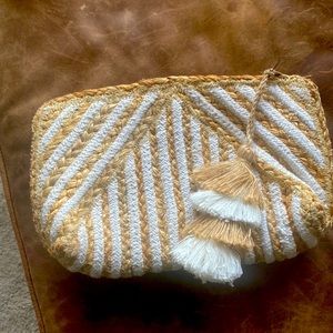 Boutique jute clutch in tan & cream with tassel zipper. Very clean inside.